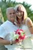 Florida Heavenly Erneuerung des Ehegeloebnisses, Paar in weiss mit Blumenbouquet